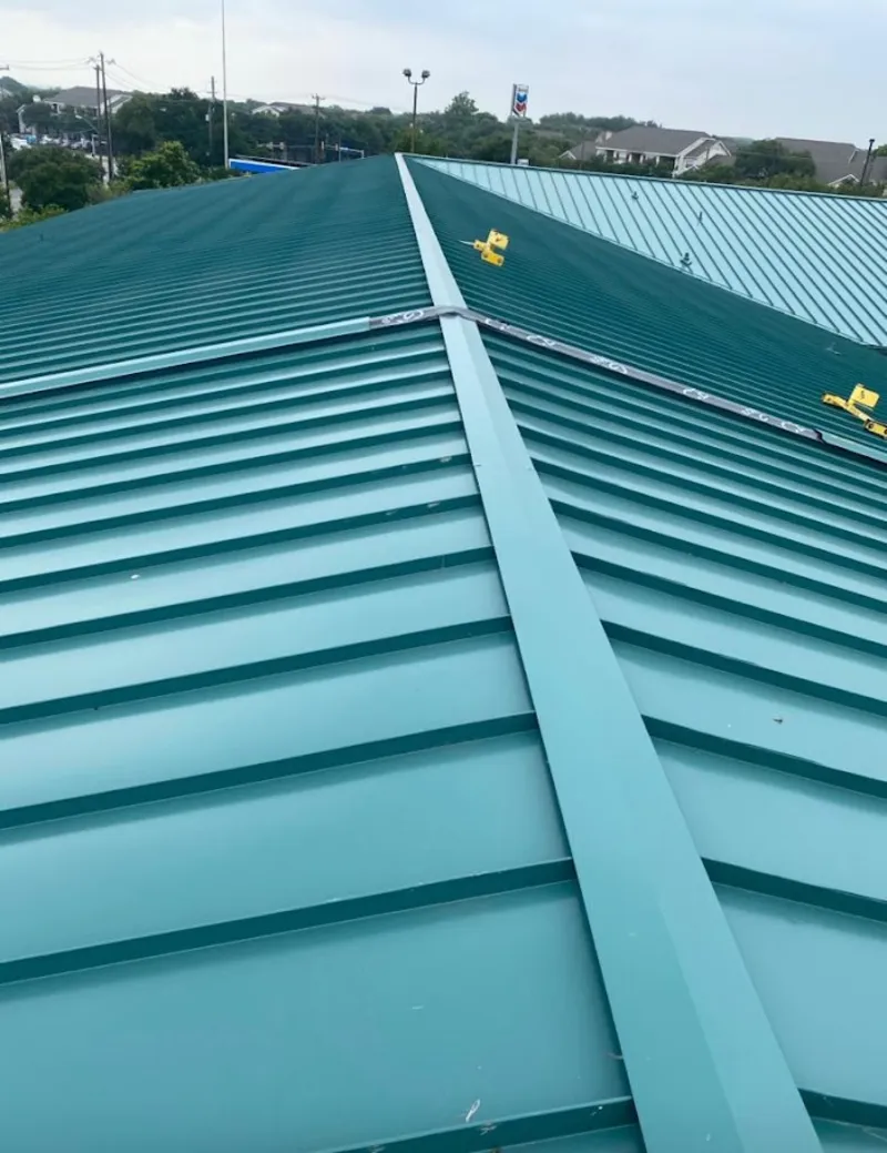 Green commercial metal roof ridge and valley for Metal Roof Repair in Spring Creek